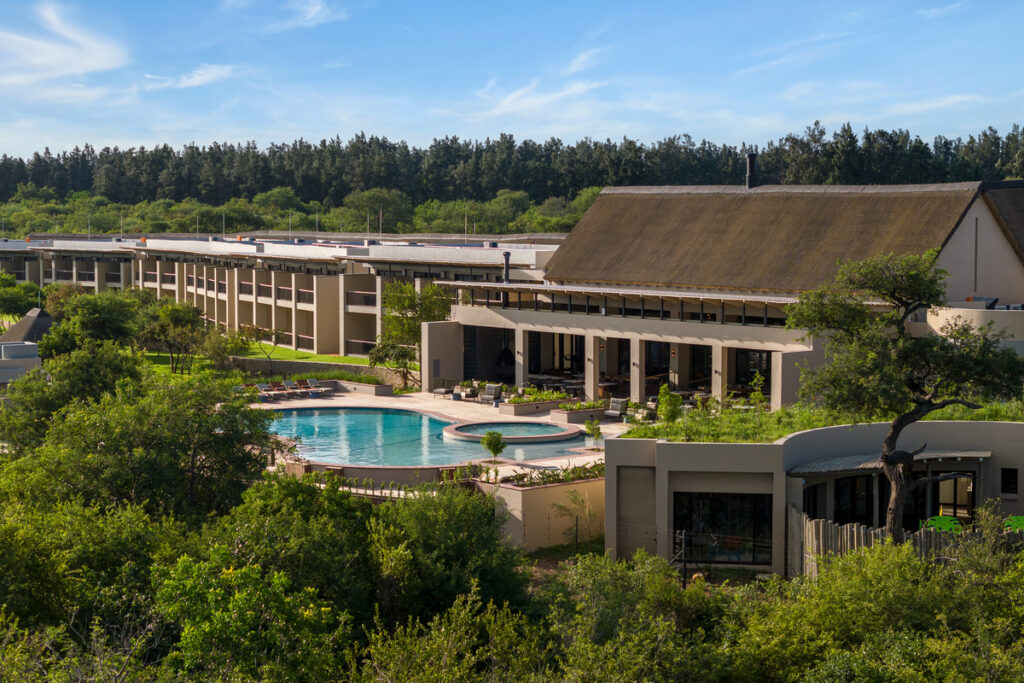 Radisson Safari Hotel Hoedspruit main building, pool and green Lowveld surroundings