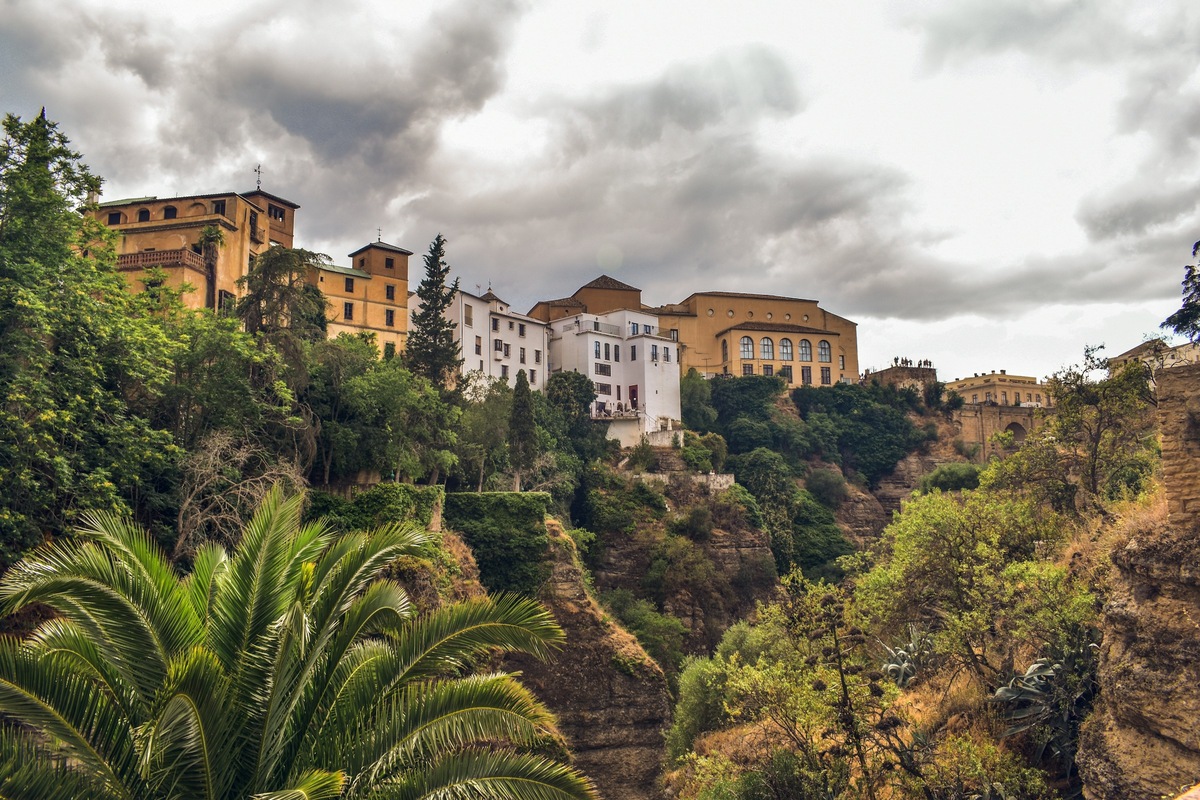 Ronda’s white buildings and historic center rise above the gorge in Spain